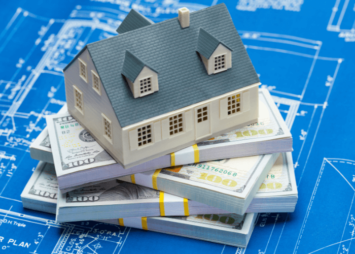 Homeowners Insurance: House on stack of cash